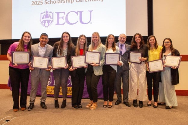 Students standing together at Scholarship ceremony